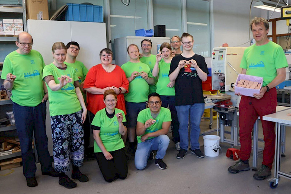 Image shows a group of people at work.